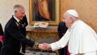 This photo taken and handout on September 18, 2023 by The Vatican Media shows Pope Francis welcoming Ivan Soltanovsky, Russian ambassador to the Holy See on the occasion of the presentation of his Credential Letters to the Pope in The Vatican. (Photo by Handout / Vatican Media / AFP)