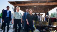 This handout picture taken and released on September 17, 2023 by Italian agency Ansa, shows the European Commission President Ursula von der Leyen (2nd Left) and Prime Minister Giorgia Meloni (right) during a visit to the Italian island of Lampedusa. (Photo by Handout / ANSA / AFP) 