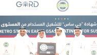 Senior QSHESE Director at Qatar Rail, Eng. Abdulrahman Al Malik and Founding Chairman of GORD, Dr. Yousef Alhorr with other officials during a ceremony to present green building certification.