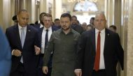 President of Ukraine Volodymyr Zelensky (centre) walks with Minority Leader Rep. Hakeem Jeffries (D-NY) (left) and Sergeant at Arms of the US House of Representatives William McFarland (right) as he arrives for a meeting with members of the US House of Representatives at the US Capitol on September 21, 2023 in Washington, DC. (Photo by Anna Moneymaker/Getty Images/AFP)