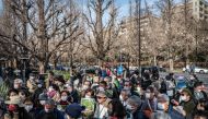 (Files) In this picture taken on February 12, 2023, people take part in a protest against the Tokyo metropolitan government's redevelopment project for the Meiji Jingu Gaien district in Tokyo.  (Photo by Yuichi Yamazaki / AFP)