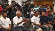 People's National Congress (PNC) candidate Mohamed Muizzu (2nd L) gestures during a press conference in Male, on September 30, 2023. (Photo by Mohamed Afrah / AFP)

