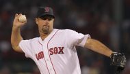 Tim Wakefield, #49 of the Boston Red Sox, throws against the Toronto Blue Jays at Fenway Park in Boston, Massachusetts, on September 13, 2011. (Photo by Jim Rogash / GETTY IMAGES NORTH AMERICA / AFP)