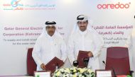 President of Kahramaa Eng. Essa bin Hilal Al Kuwari and Chief Executive Officer of Ooredoo Qatar Sheikh Ali bin Jabor Al Than exchanging documents after signing a contract.