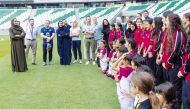 Vice-Chairperson and CEO of Qatar Foundation H E Sheikha Hind bint Hamad Al Thani and other officials with young athletes at the launch of  QF’s partnership with Volkswagen Middle East.