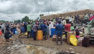 Displaced Sudanese wait to cross into Ethiopia from Sudan's border town of Gallabat, on August 3, 2023. (Photo by AFP)