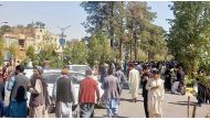 People gather on the streets in Herat on October 7, 2023. (Photo by AFP)