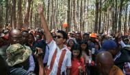 Incumbent Madagascar President Andry Rajoelina, greets supporters as he attends the first meeting of his electoral campaign, in Antananarivo, on October 10, 2023. (Photo by RIJASOLO / AFP)
