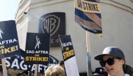 Striking SAG-AFTRA members picket outside Warner Bros. Studio as the actors strike continues on September 26, 2023 in Burbank, California. (Photo by MARIO TAMA / GETTY IMAGES NORTH AMERICA / Getty Images via AFP)

