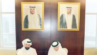 Assistant Minister of Health Affairs at the Ministry of Public Health, Dr. Saleh Ali Al Marri (right) and QRDI Council Secretary-General Eng. Omar Al Ansari signing the agreement. 