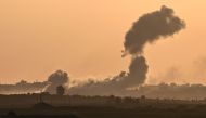 Smoke billowing during Israeli bombardment in the north of the Gaza Strip on October 30, 2023. (Photo by Yuri Cortez / AFP)
