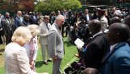Britain's King Charles III (centre) meets Kenyan war veterans during a visit to a Commonwealth War Graves Kariokor Cemetery in Nairobi on November 1, 2023.(Photo by Tony Karumba / POOL / AFP)