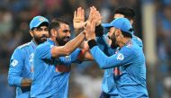 India celebrates during the 2023 ICC Men's Cricket World Cup one-day international (ODI) match between India and Sri Lanka at the Wankhede Stadium in Mumbai on November 2, 2023. (Photo by Punit Paranjpe / AFP)