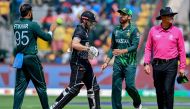 Pakistan's Iftikhar Ahmed (L) celebrates with teammate after taking the wicket of New Zealand's captain Kane Williamson (2L) during the 2023 ICC Men's Cricket World Cup one-day international (ODI) match between New Zealand and Pakistan at the M. Chinnaswamy Stadium in Bengaluru on November 4, 2023. (Photo by Sajjad HUSSAIN / AFP)
