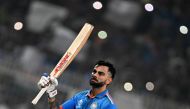 India's Virat Kohli celebrates after scoring a century (100 runs) during the 2023 ICC Men's Cricket World Cup one-day international (ODI) match on November 5, 2023. (Photo by Dibyangshu Sarkar / AFP) 