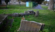 This general view shows a cross of a calvary lying on the ground after it was hit by strong winds due to Storm Ciaran at Saint-Igneuc, western France on November 6, 2023. (Photo by Damien MEYER / AFP)
