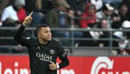 Paris Saint-Germain's French forward #07 Kylian Mbappe celebrates after opening the scoring during the French L1 football match between Stade de Reims and Paris Saint-Germain (PSG) at Stade Auguste-Delaune in Reims, northern France on November 11, 2023. (Photo by FRANCOIS NASCIMBENI / AFP)
