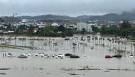 Flood waters submerge parked cars in Hue city in central Vietnam on November 15, 2023. (Photo by Hai Duong / AFP)