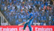 India's Virat Kohli celebrates after scoring a century (100 runs) at the Wankhede Stadium in Mumbai on November 15, 2023. (Photo by Indranil Mukherjee / AFP) 