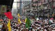 Islami Andolan Bangladesh party activists march towards the election commission in Dhaka on November 15, 2023, to protest the announcement of the general election date by the commission in Dhaka. (Photo by Munir uz ZAMAN / AFP)
