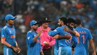 India's players celebrate their victory at the end of the 2023 ICC Men's Cricket World Cup one-day international (ODI) first semi-final match between India and New Zealand at the Wankhede Stadium in Mumbai on November 15, 2023. (Photo by Punit PARANJPE / AFP)