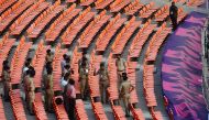 Security preparations on the stands of the Narendra Modi Stadium in Ahmedabad on November 17, 2023. (Photo by Sam Panthaky / AFP)
