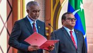 Maldives' president-elect Mohamed Muizzu (L) reads out his oath during his inauguration ceremony in Male on November 17, 2023. (Photo by Ishara S. KODIKARA / AFP)
