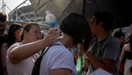 Fans of US singer Taylor Swift queue outside the Nilton Santos Olympic Stadium before Swift's concert, 