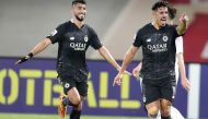 Al Sadd's Baghdad Bounedjah (right) celebrates with Mohammed Waad after scoring their second goal.