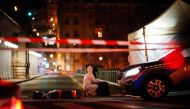 A forensic police officer works at the scene of a stabbing in Paris on December 2, 2023. (Photo by Dimitar Dilkoff / AFP)