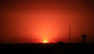 An Israeli air strike lights the sky above Khan Yunis in the southern Gaza Strip on December 2, 2023. (Photo by Said Khatib / AFP)
