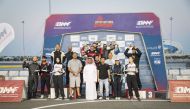 The Championship title winners and podium winners in the final round of the Qatar National Sprint pose for a photograph with officials.