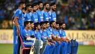 India's players pose for a group photograph before the start of the fifth and final Twenty20 international cricket match between India and Australia at the M. Chinnaswamy Stadium in Bengaluru on December 3, 2023. (Photo by Punit PARANJPE / AFP)