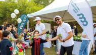 Al Abdulghani Motors officials taking part in 'Children Above All' event at the Education City.