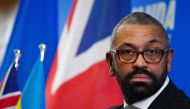 Britain's Home Secretary James Cleverly speaks during a joint press conference with his Rwanda's Foreign Minister after signing a new treaty, in Kigali on December 5, 2023. (Photo by Ben Birchall / POOL / AFP)