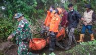 Rescuers evacuate one of the victims who died on Mount Marapi when it erupted on December 3, in Agam, West Sumatra province, on December 5, 2023. Photo by ADI PRIMA / AFP