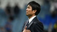 Japan's coach #00 Hajime Moriyasu greets the fans after his team's defeat in the Qatar 2022 World Cup round of 16 football match between Japan and Croatia at the Al-Janoub Stadium in Al-Wakrah, south of Doha on December 5, 2022. (Photo by Ina Fassbender / AFP)

