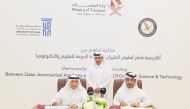 Minister of Transport H E Jassim Saif Ahmed Al Sulaiti looks on as QAA Director-General Sheikh Jabor bin Hamad Al Thani (right) and UDST President Dr. Salem Al Naemi sign a memorandum of understanding yesterday. 