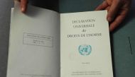 This photograph taken on December 9, 2023, shows a document from the Department of Information of the United Nations, dated March 1949, bearing the French text of the 