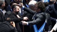 Argentina's new president Javier Milei (R) is greeted by Ukraine's President Volodymyr Zelensky after delivering his inaugural speech before the crowd during an inauguration ceremony at the Congress in Buenos Aires on December 10, 2023. (Photo by Luis ROBAYO / AFP)