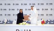 Minister of Communications and Information Technology H E Mohammed bin Ali Al Mannai and Secretary-General of the DCO H E Deemah AlYahya during the signing of the charter. 