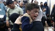 Palestinians injured following Israeli strikes on al-Maghazi refugee camp receive care at Al-Aqsa hospital in Deir Balah in the central Gaza Strip on December 11, 2023. Photo by AFP