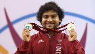 Fares Ibrahim celebrates with his medals.