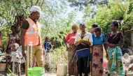 Kelvin Josephat Kituruka (front), a native of Mwanza who joined the China Civil Engineering Construction Corporation (CCECC) as a quality engineer, helps local villagers with access to drinking water in Misungwi of Mwanza Region, Tanzania, recently. (Xinhua/Wang Guansen) 