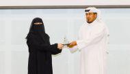 Assistant Undersecretary for Dawah and Mosque Affairs Mohammed Hamad Al Kuwari honouring Managing Director of PHCC Dr. Mariam Ali Abdulmalik during the ceremony.
