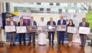 Qatar Airways officials showing off the recognition from Gulf Organisation for Research and Development .