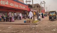 File photo: People queue for bread in front of a bakery in Omdurman on July 15, 2023. (AFP)