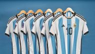 This undated photo courtesy of Sotheby's shows Lionel Messi's set of six match worn shirts from the 2022 FIFA World Cup. (Photo by SOTHEBY'S / AFP) 

