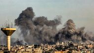 Smoke billows from Israeli bombardment over Khan Yunis from Rafah in the southern Gaza Strip on December 16, 2023. Photo by SAID KHATIB / AFP