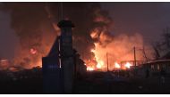 This image grab taken from AFPTV video footage on December 18, 2023 shows flames from the fire at Conakry's main fuel depot. Photo by STRINGER / AFP